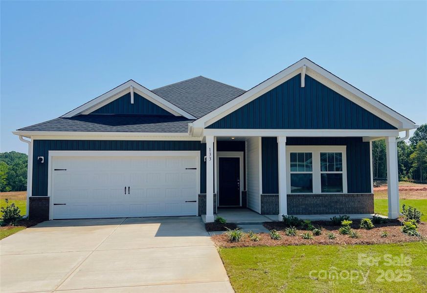 Front exterior of a new home in Nelson's Creek, Mocksville, NC, highlighting curb appeal (Image 1). Front exterior of a new home in Nelson's Creek, Mocksville, NC, highlighting curb appeal (Image 1).