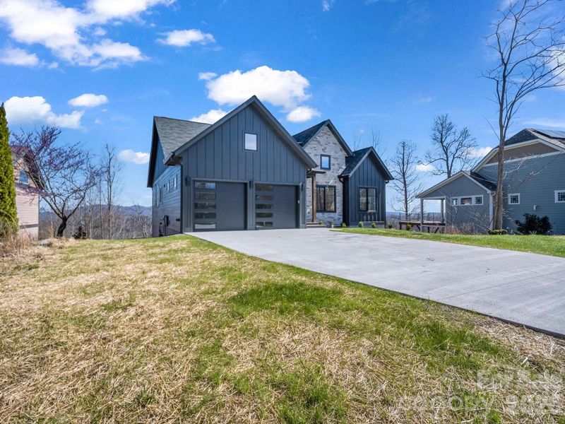 Front exterior of a new home in , Hendersonville, NC, highlighting curb appeal (Image 18). Front exterior of a new home in , Hendersonville, NC, highlighting curb appeal (Image 18).