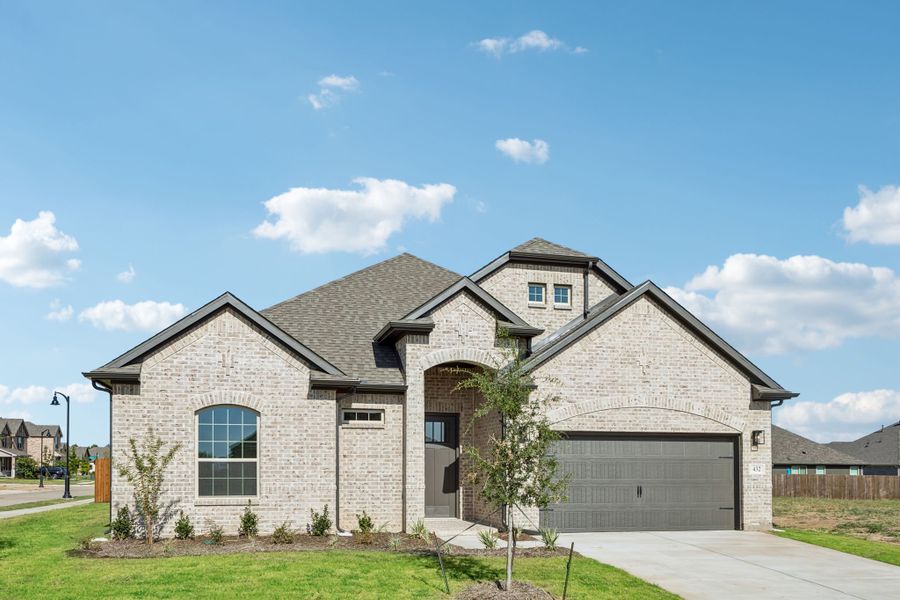 Front exterior of a new home in Sheppard's Place, Waxahachie, TX, highlighting curb appeal (Image 2). Front exterior of a new home in Sheppard's Place, Waxahachie, TX, highlighting curb appeal (Image 2).