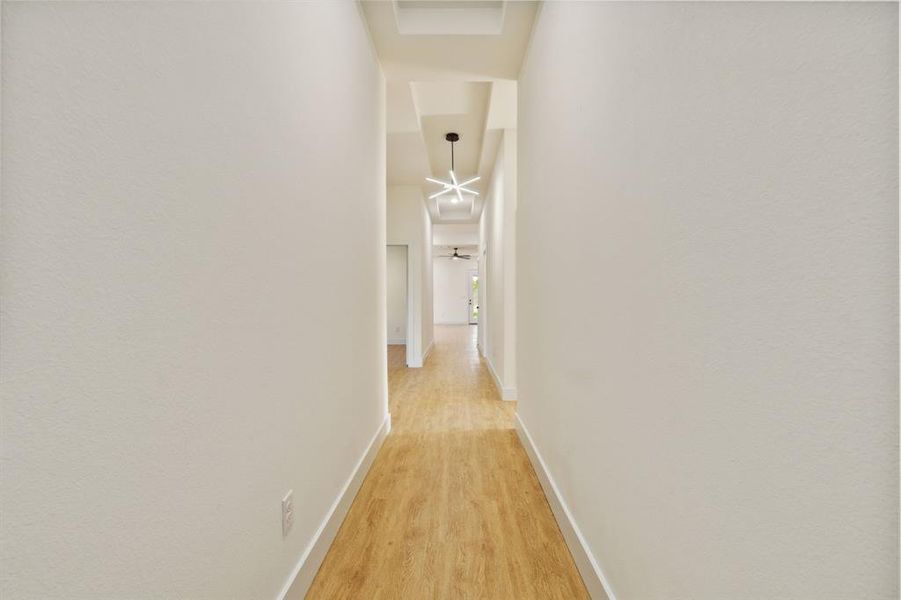 Hallway with light wood-type flooring