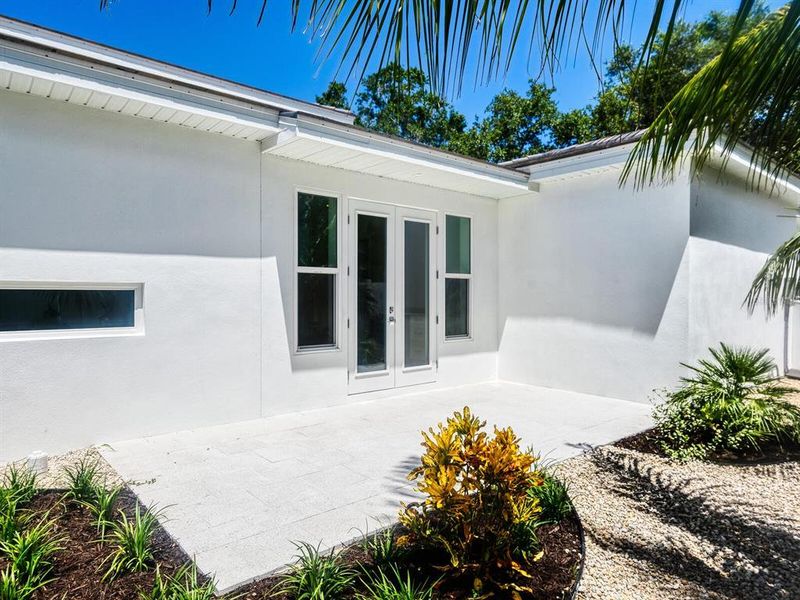 Front exterior of a new home in , Sarasota, FL, highlighting curb appeal (Image 32).