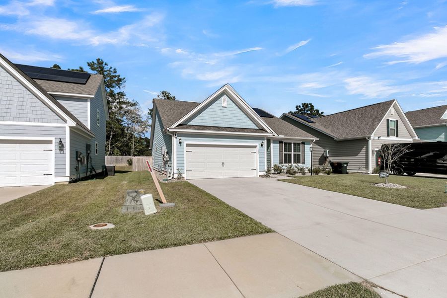 Front exterior of a new home in Abbey Walk, Moncks Corner, SC, highlighting curb appeal (Image 28).
