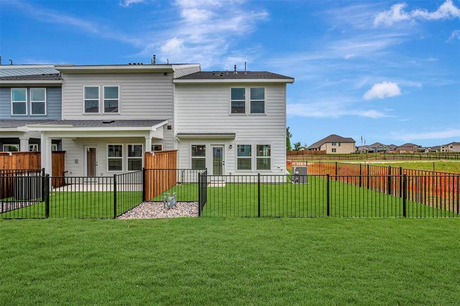 Exterior details and patio area of a home in Providence Commons, Providence Village (Image 17).