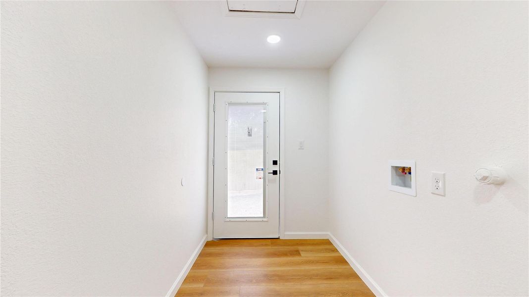 Large mud room with back yard entry