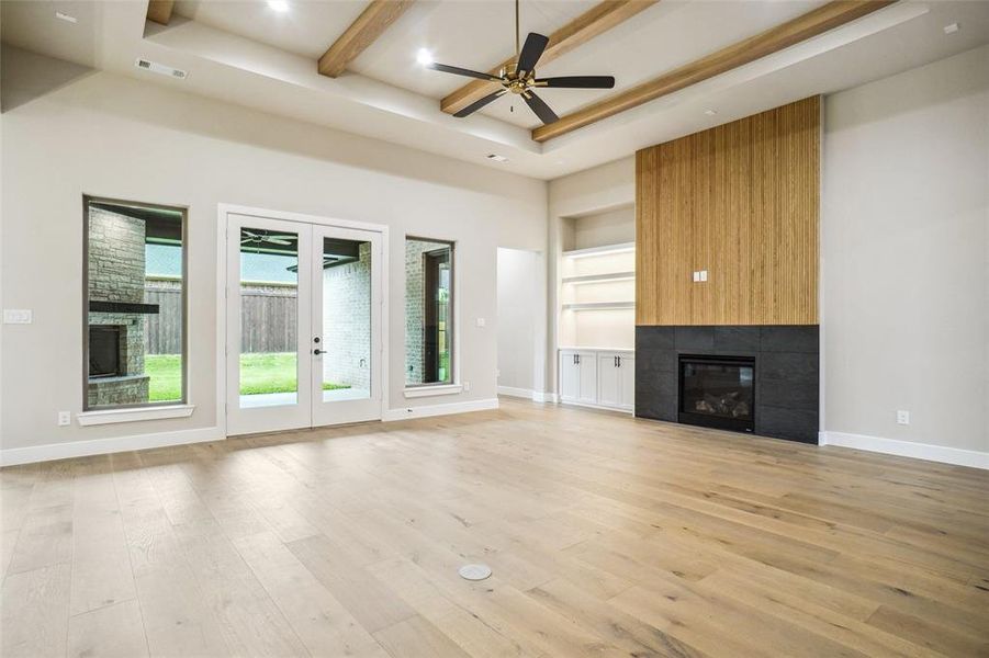 Great room features a gas fireplace, flat screen wiring, LED lit floating shelves with cabinet storage below! Great room features a gas fireplace, flat screen wiring, LED lit floating shelves with cabinet storage below!