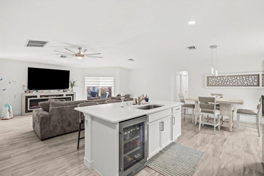 View from Kitchen to Family Room Highlighting the Integrated Wine and Beverage Cooler