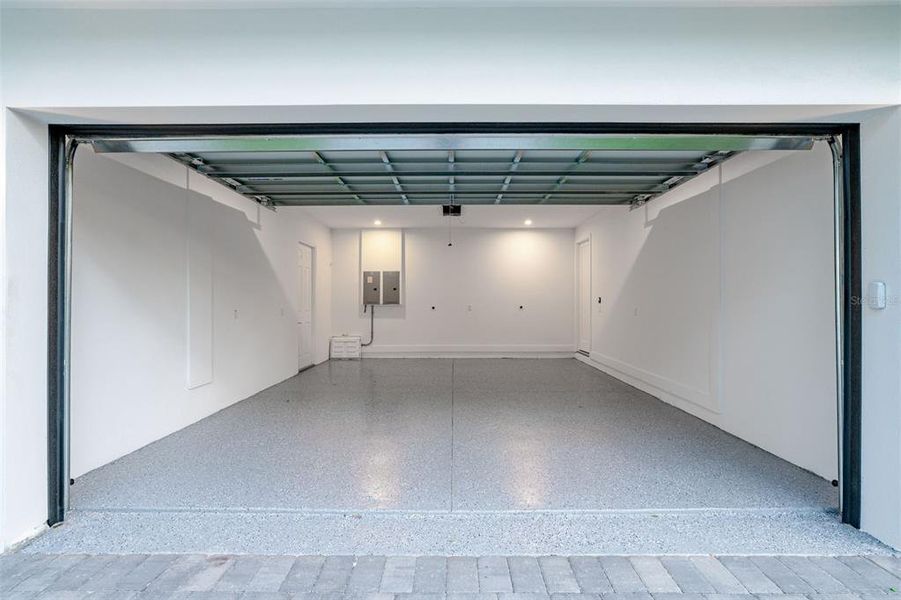 two car garage that includes outlet for electric cars