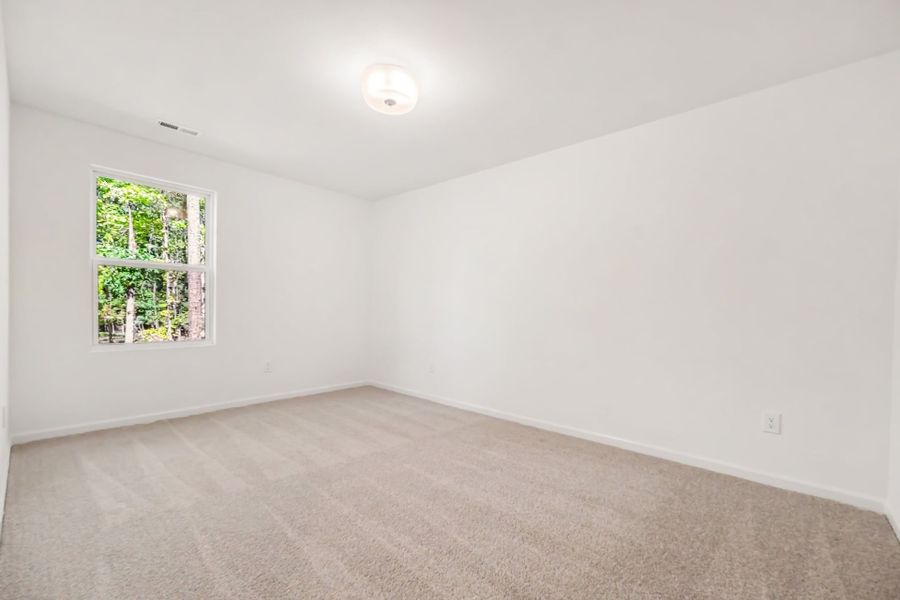 Spacious, unfurnished interior of a new home in Lake Royale, Louisburg (Image 17).