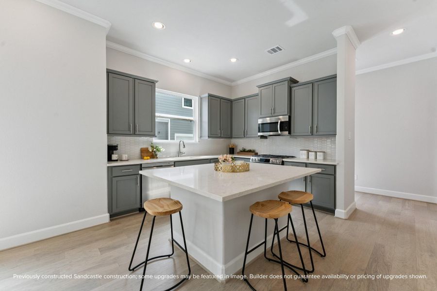 A Chef’s Dream Kitchen – Modern quartz countertops, stainless steel appliances, and a functional island make this kitchen the heart of the home.