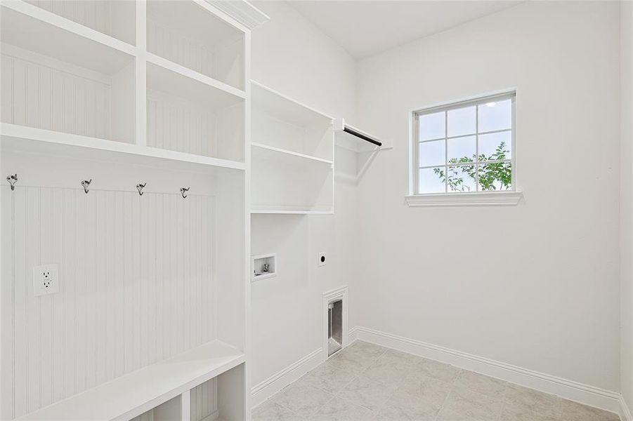 Laundry area featuring electric dryer hookup and washer hookup