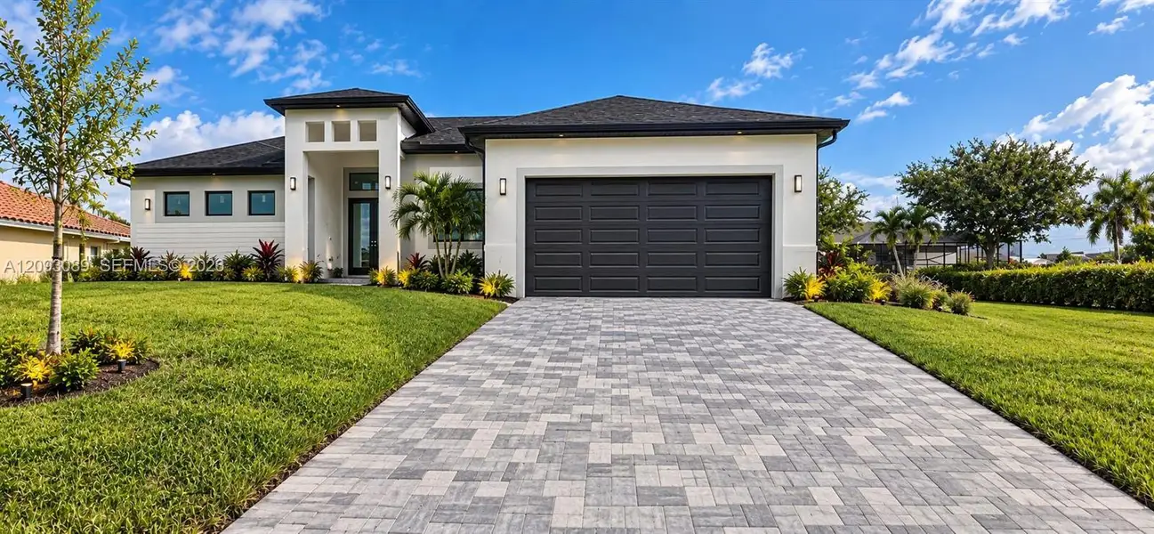 Front exterior of a new home in , Cape Coral, FL, highlighting curb appeal (Image 24).