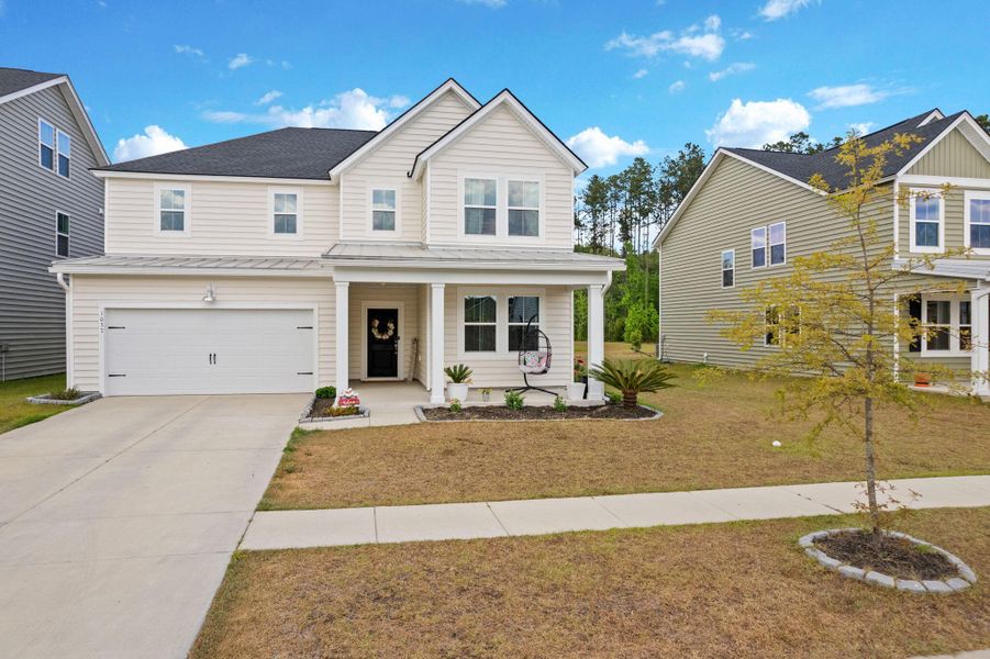 Front exterior of a new home in Sweetgrass at Summers Corner, Summerville, SC, highlighting curb appeal (Image 1). Front exterior of a new home in Sweetgrass at Summers Corner, Summerville, SC, highlighting curb appeal (Image 1).