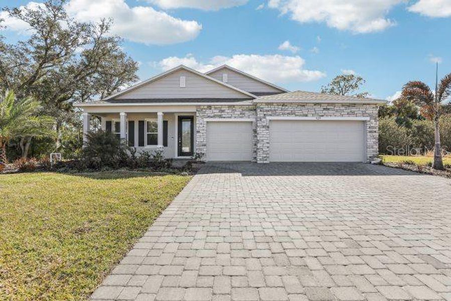 Front exterior of a new home in , North Port, FL, highlighting curb appeal (Image 1). Front exterior of a new home in , North Port, FL, highlighting curb appeal (Image 1).
