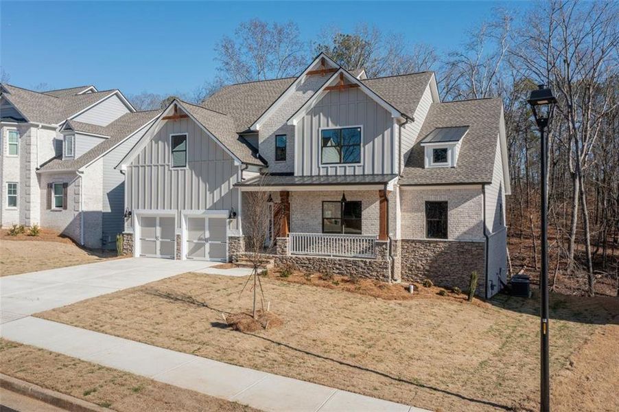 Front exterior of a new home in , Douglasville, GA, highlighting curb appeal (Image 20).