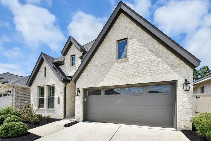 Front exterior of a new home in , Magnolia, TX, highlighting curb appeal (Image 21).