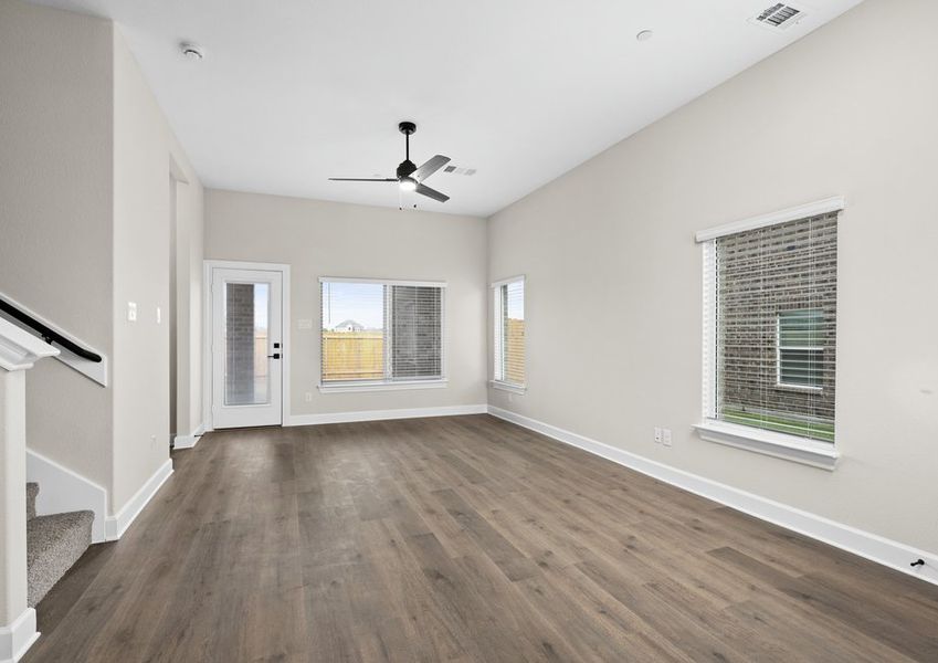 The living room has large windows that let in great, natural light.