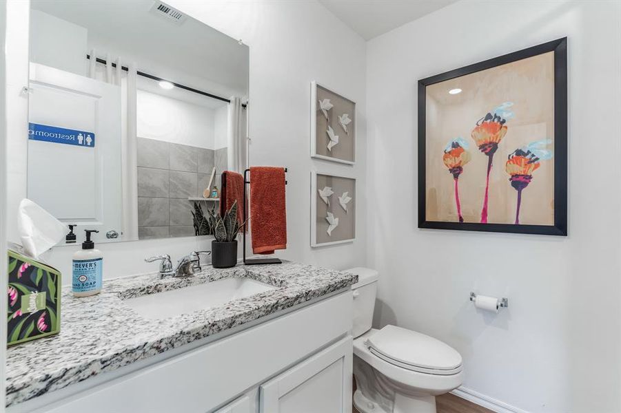 Bathroom featuring vanity and toilet