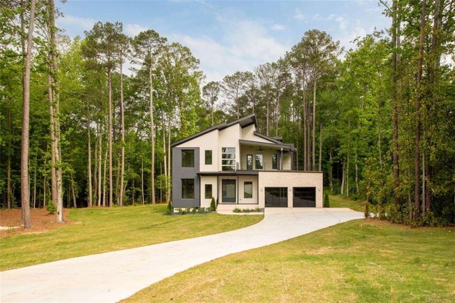 Front exterior of a new home in , South Fulton, GA, highlighting curb appeal (Image 26). Front exterior of a new home in , South Fulton, GA, highlighting curb appeal (Image 26).