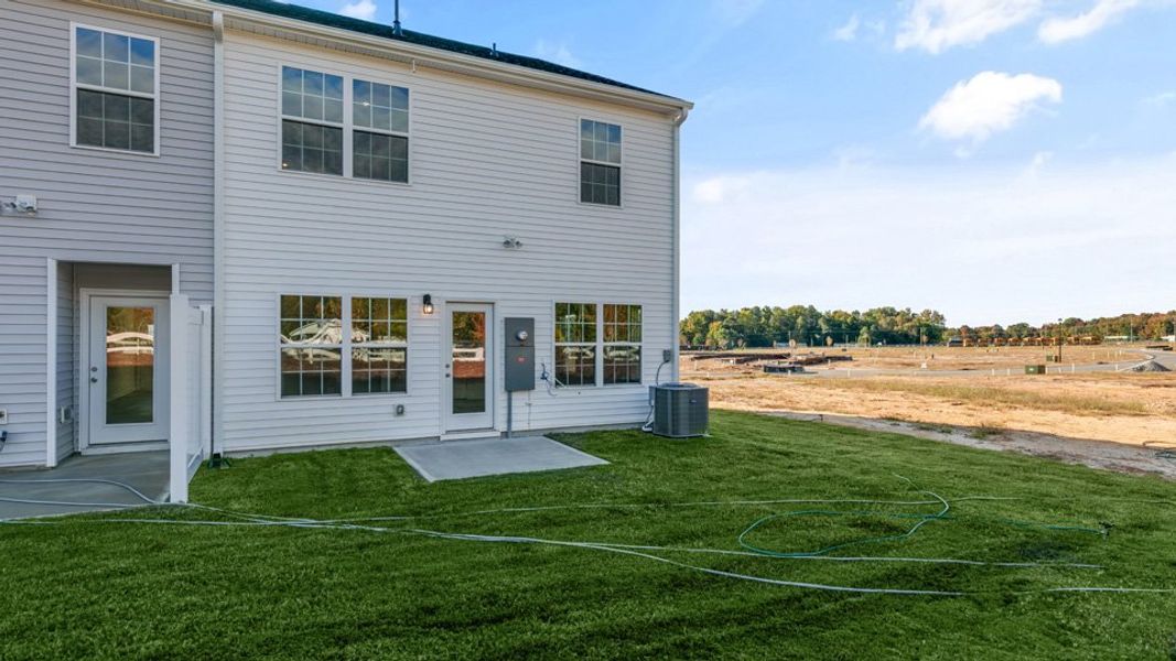Front exterior of a new home in Brightwood Farm, Whitsett, NC, highlighting curb appeal (Image 15).
