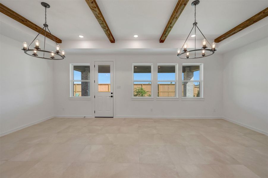 Bright and airy living area with stained ceiling beams