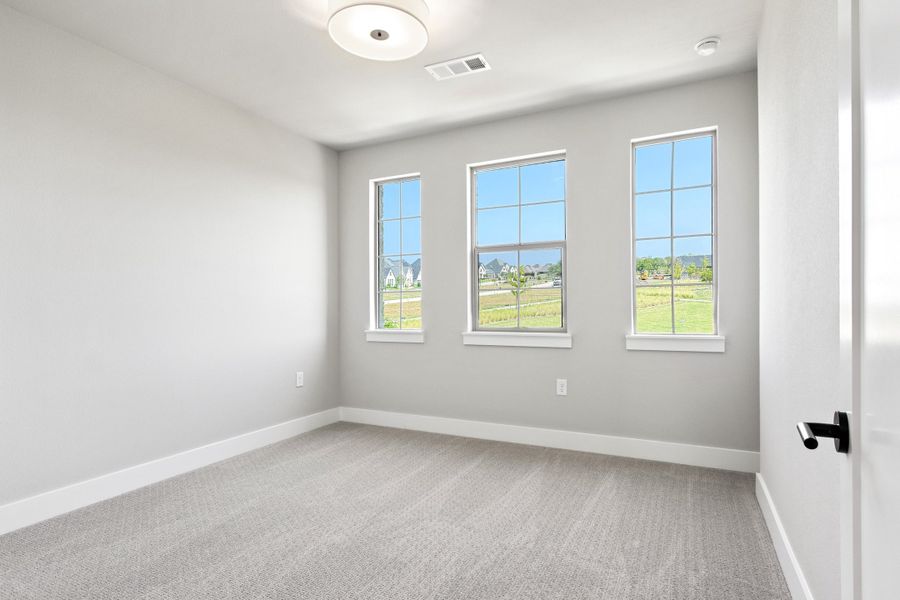 Spacious, unfurnished interior of a new home in The Tribute, The Colony (Image 37).