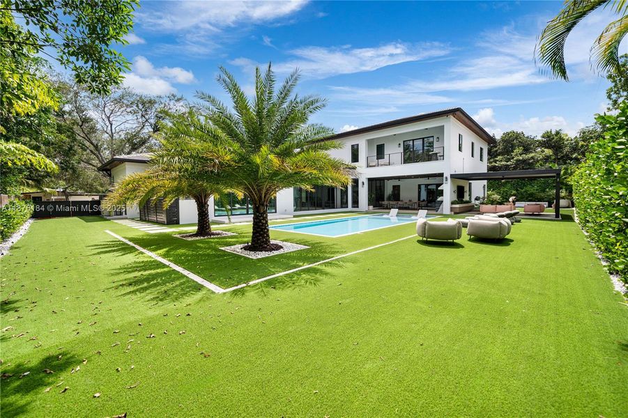 Front exterior of a new home in , Pinecrest, FL, highlighting curb appeal (Image 18). Front exterior of a new home in , Pinecrest, FL, highlighting curb appeal (Image 18).