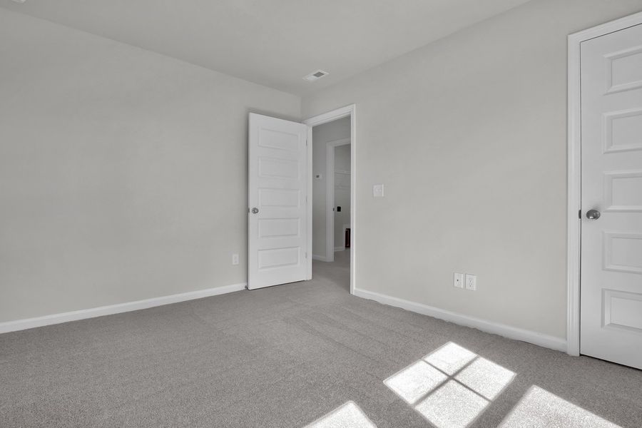 Spacious, unfurnished interior of a new home in Grand Park, Leland (Image 27). Spacious, unfurnished interior of a new home in Grand Park, Leland (Image 27).