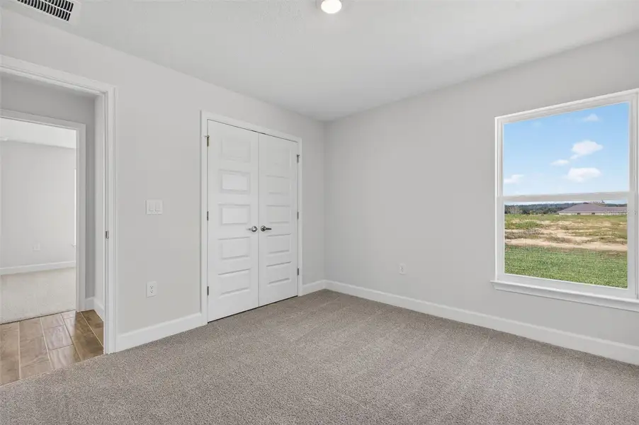 Spacious, unfurnished interior of a new home in Hill Country Estates, Dade City (Image 24).