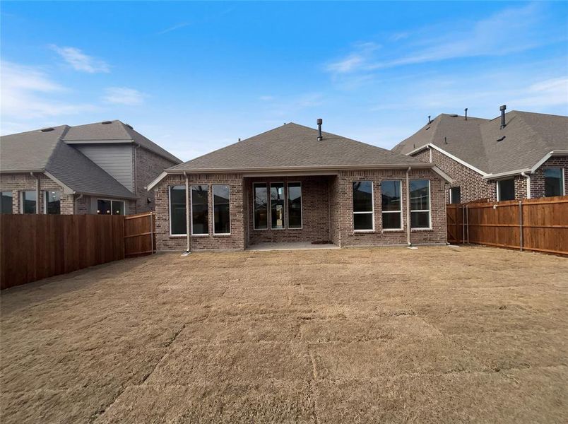 Exterior details and patio area of a home in Shaded Tree, McKinney (Image 4).