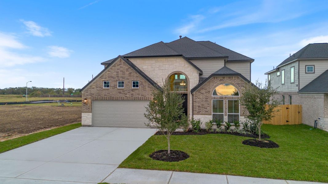 Front exterior of a new home in Briarwood Crossing, Rosenberg, TX, highlighting curb appeal (Image 22).
