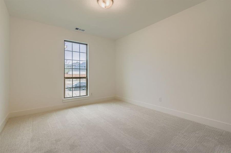 Unfurnished room featuring light carpet and baseboards Unfurnished room featuring light carpet and baseboards