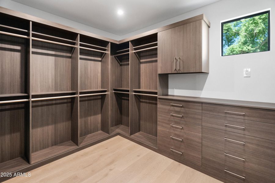 Primary Walk-In Closet (1 of 2) Primary Walk-In Closet (1 of 2)