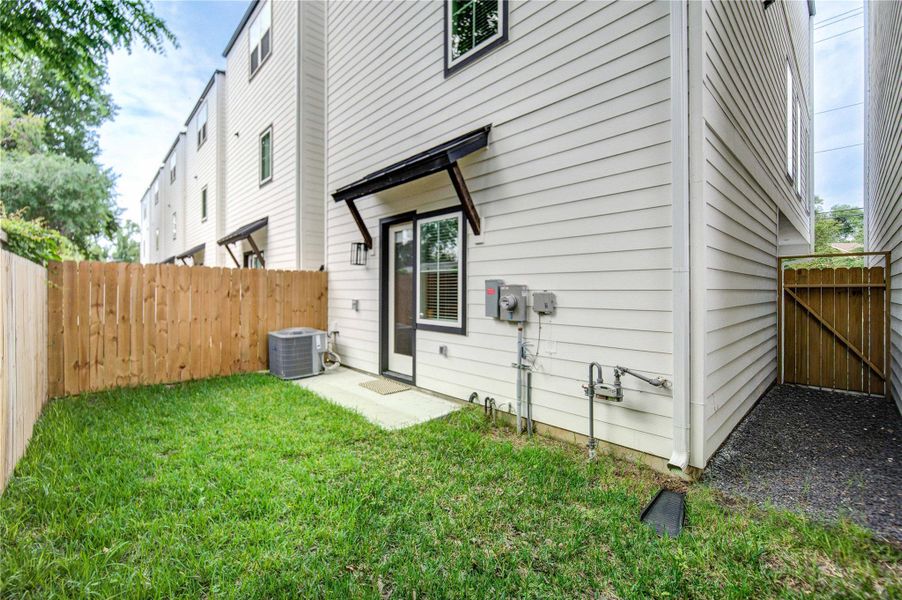 Fenced backyard ideal for relaxing or pets.