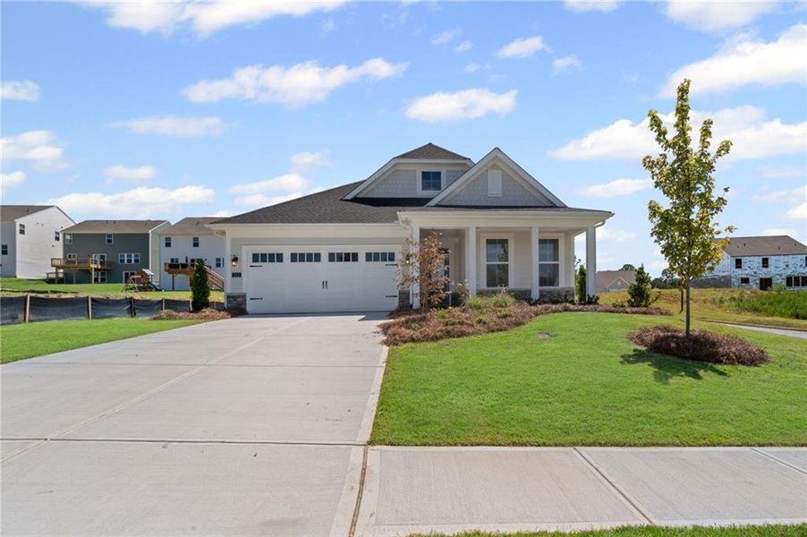 Front exterior of a new home in Twin Lakes, Hoschton, GA, highlighting curb appeal (Image 2). Front exterior of a new home in Twin Lakes, Hoschton, GA, highlighting curb appeal (Image 2).