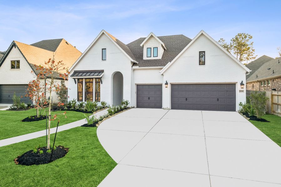 Front exterior of a new home in ARTAVIA - Parkview Collection, Conroe, TX, highlighting curb appeal (Image 2). Front exterior of a new home in ARTAVIA - Parkview Collection, Conroe, TX, highlighting curb appeal (Image 2).