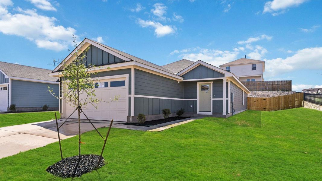 Front exterior of a new home in Wayside, Uhland, TX, highlighting curb appeal (Image 14).