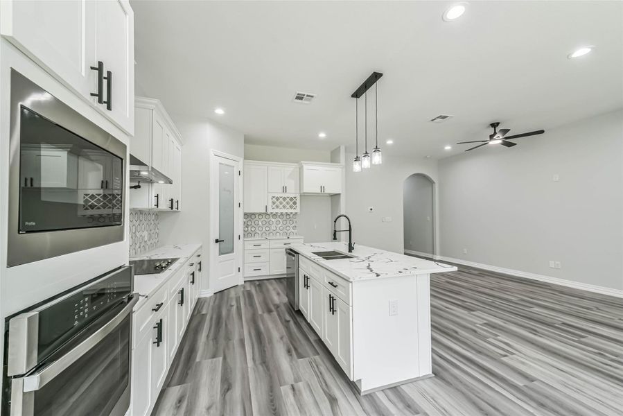 Furnished interior view inside a new home in , Conroe (Image 12).
