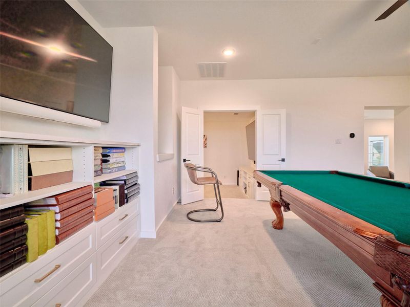 Enjoy movie nights in your private game room and theater, conveniently located by the kitchen stairs