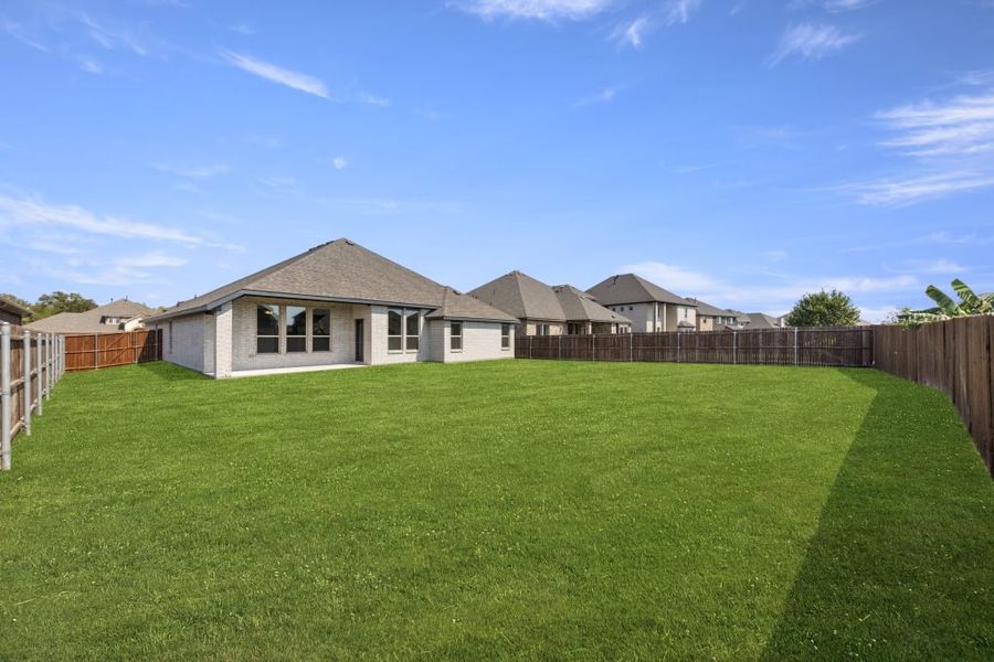 Representative exterior photo of a completed home built from the Hampton by Impression Homes in Timberbrook, Justin, TX (Image 25). Representative exterior photo of a completed home built from the Hampton by Impression Homes in Timberbrook, Justin, TX (Image 25).