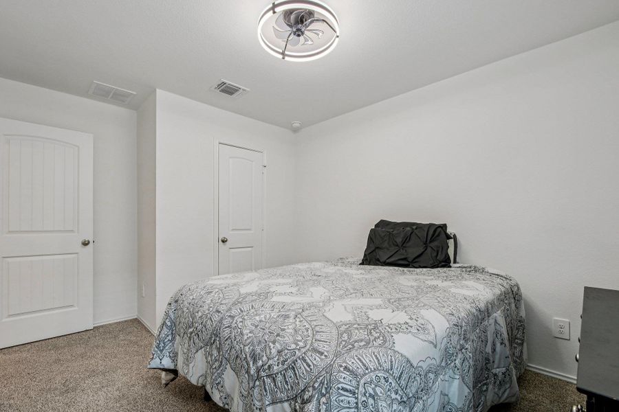Bedroom with carpet and baseboards