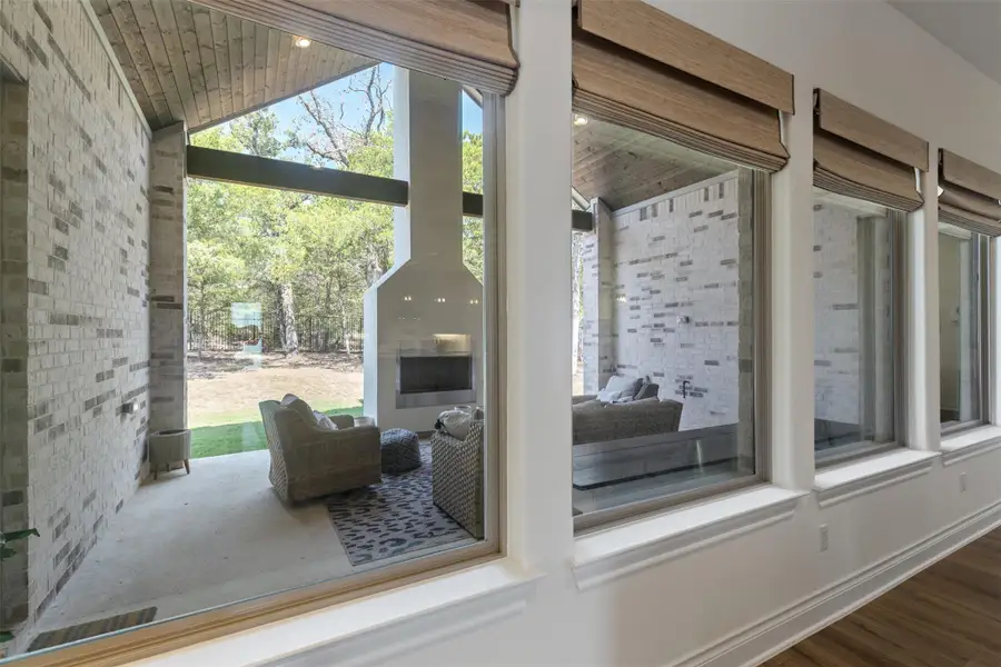 Entryway featuring vaulted ceiling, plenty of natural light, and wood finished floors Entryway featuring vaulted ceiling, plenty of natural light, and wood finished floors