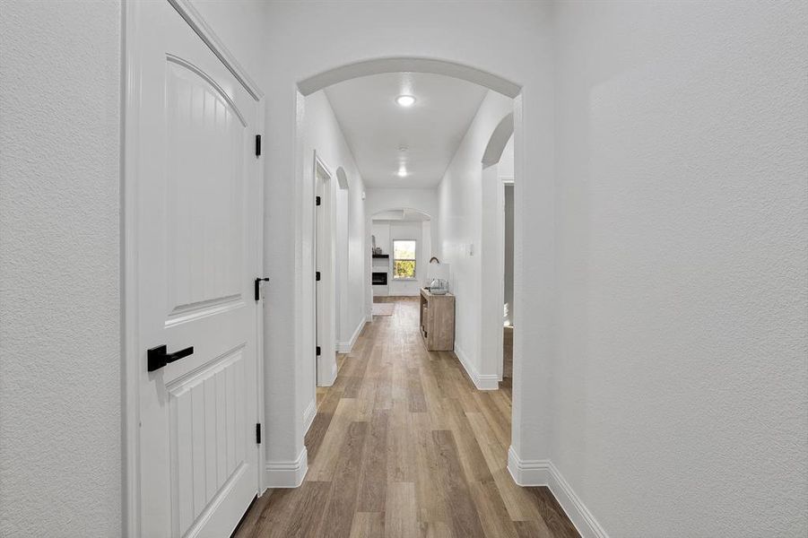 Hallway with light wood-type flooring