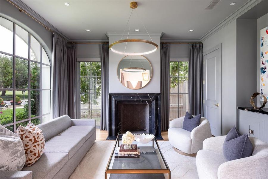 Living room with marble gas fireplace overlooking front yard