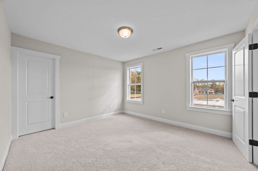 Spacious, unfurnished interior of a new home in Eli's Ridge, Winterville (Image 44).