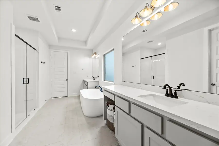 Bright, spotless, and modern, this stunning ensuite is ready to help you prepare for today’s adventures in complete comfort and style.