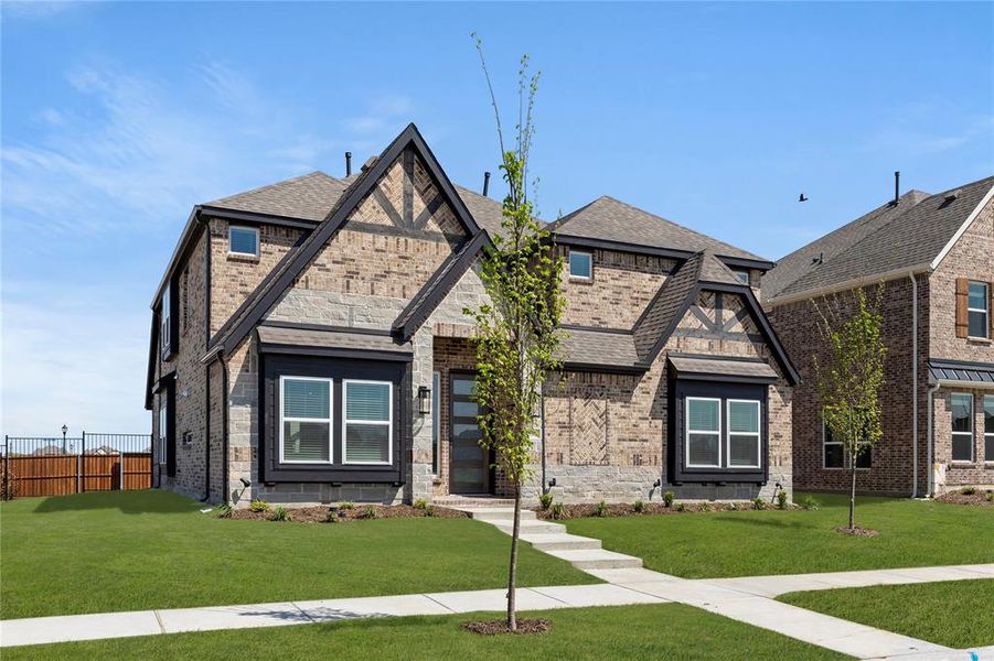 Front exterior of a new home in Villages of Creekwood, Frisco, TX, highlighting curb appeal (Image 16). Front exterior of a new home in Villages of Creekwood, Frisco, TX, highlighting curb appeal (Image 16).