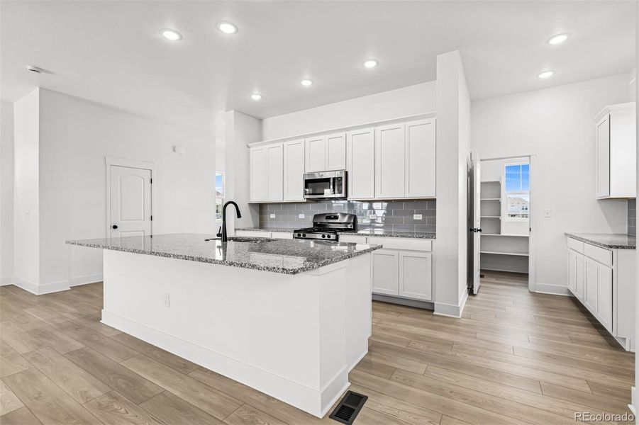 Furnished interior view inside a new home in Painted Prairie Cottage, Aurora (Image 14).