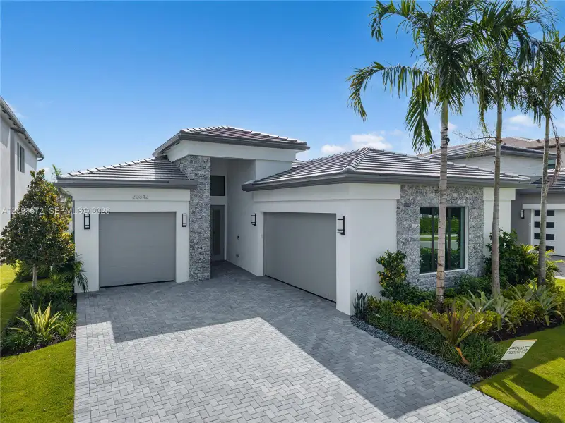 Front exterior of a new home in , Boca Raton, FL, highlighting curb appeal (Image 2). Front exterior of a new home in , Boca Raton, FL, highlighting curb appeal (Image 2).