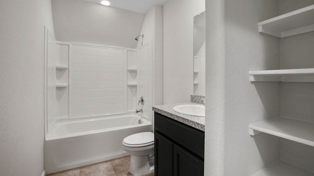 Representative furnished interior of a home built from the Ozark by D.R. Horton in Saratoga, Granbury (Image 11).