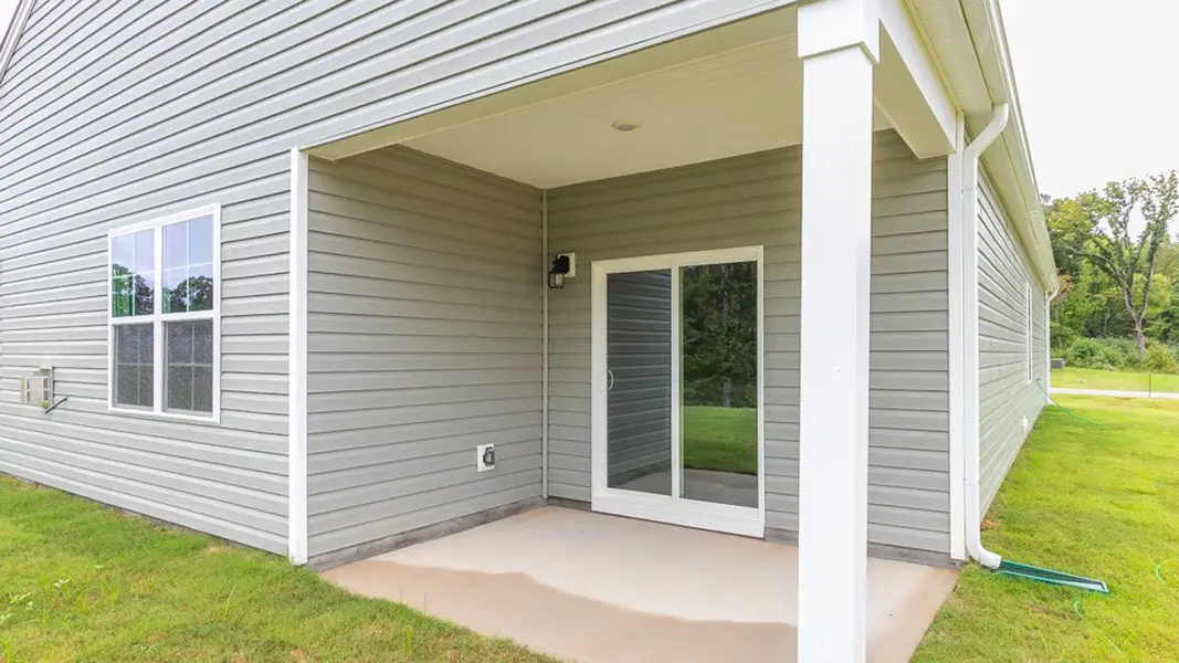 Exterior details and patio area of a home in The Landing at Summerhaven, Mebane (Image 3).